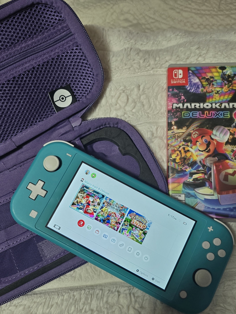 Nintendo Switch Lite Turquoise Handheld Console with Game Case